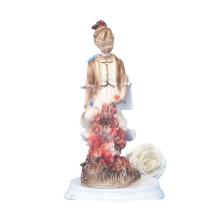 FIGURA NIÑA CON REGADERA